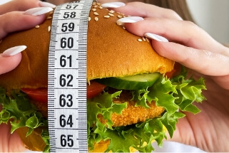 harmful-fatty-burger-with-a-measuring-tape-concep-2023-11-27-05-21-51-utc (1)