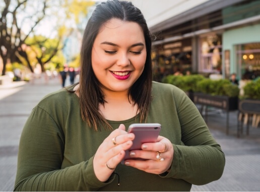 young-plus-size-woman-using-her-mobile-phone-2024-10-17-00-46-11-utc